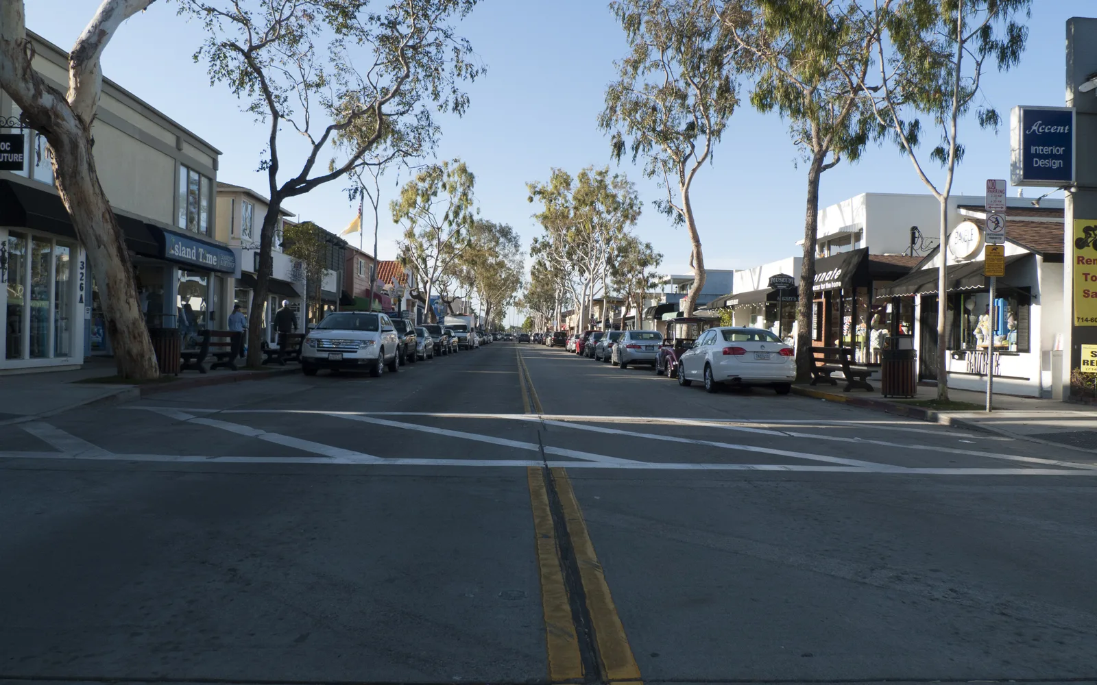 Balboa Island pedestrian street with waterfront shops and restaurants
